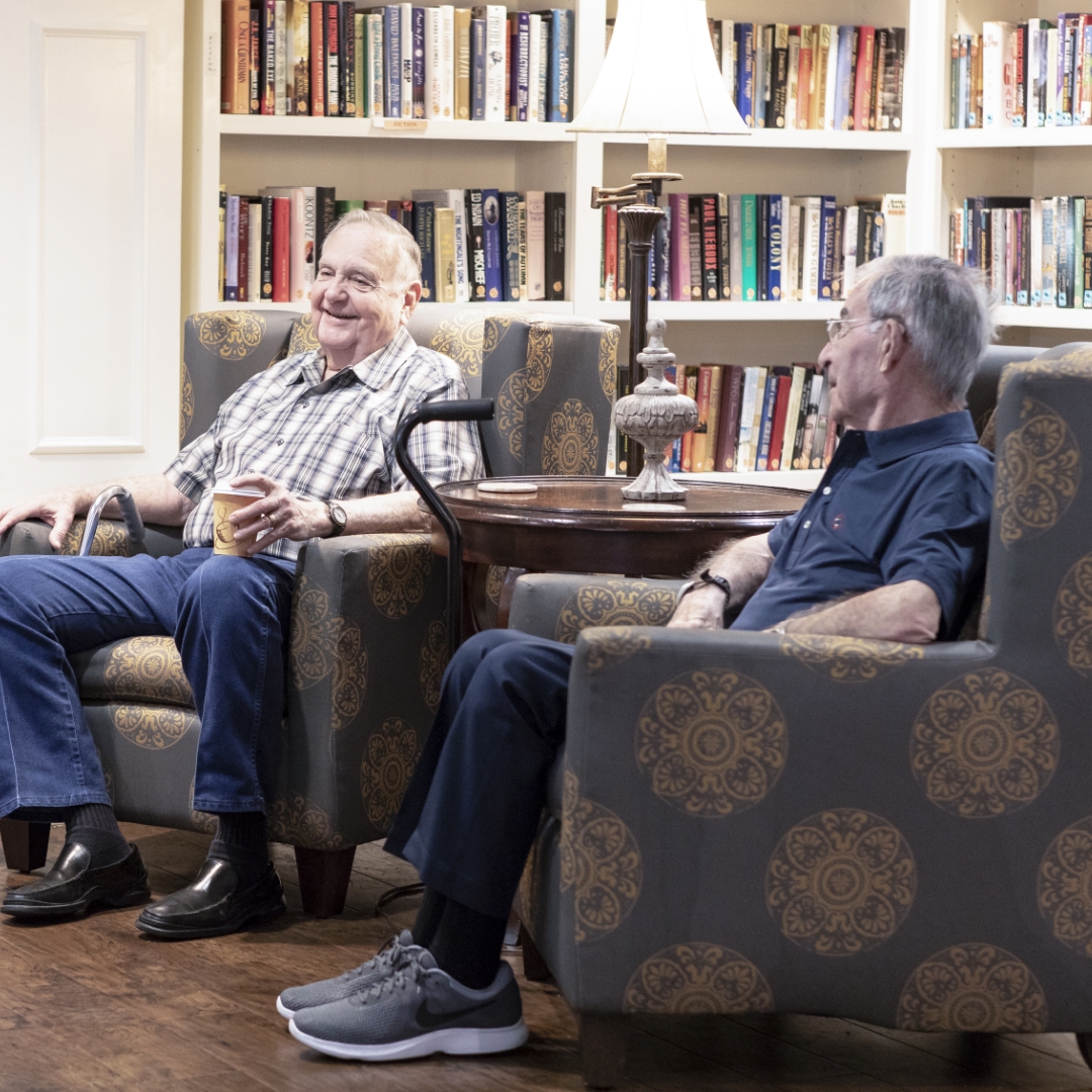 two men sitting in library